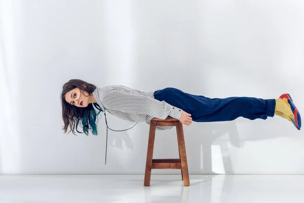 Young Girl Lying Wooden Chair — Free Stock Photo