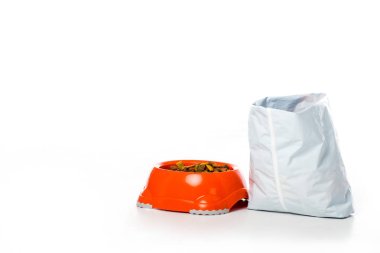close-up view of plastic bowl and bag with animal food isolated on white clipart