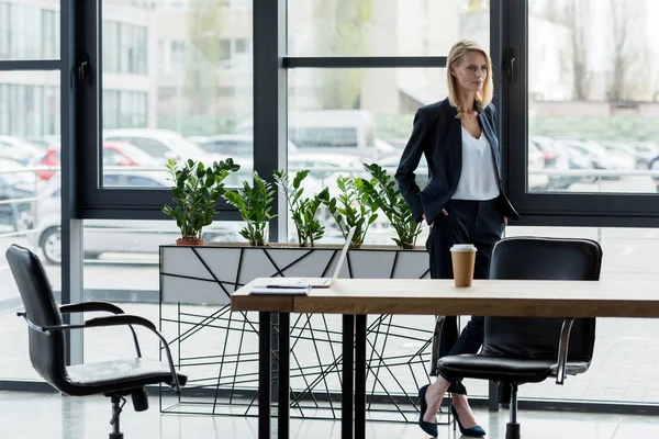 Confident Businesswoman Standing Hands Pockets Looking Away Office — Stock Photo, Image