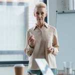 Grey hair businesswoman at meeting in office
