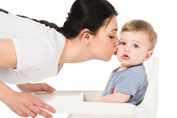 Young Woman Kissing Little Son Highchair Isolated White Background — Stock Photo, Image