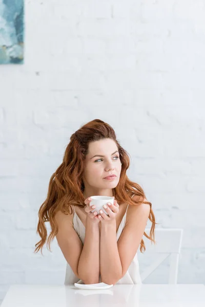 Thoughtful Young Woman Cup Coffee Front White Brick Wall Looking — Free Stock Photo