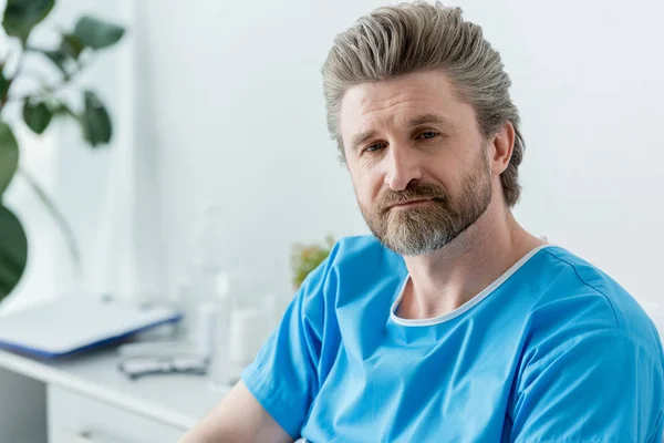 Handsome Patient Medical Gown Looking Away Hospital — Stock Photo, Image