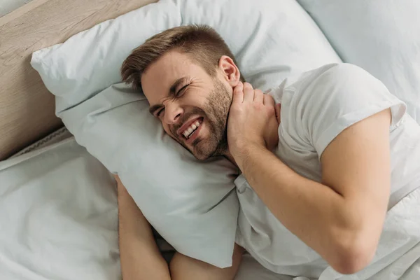 Overhead View Young Man Touching Neck While Suffering Pain — Stock Photo, Image