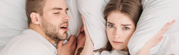 Top View Exhausted Woman Plugging Ears Pillow While Lying Bed — Stock Photo, Image