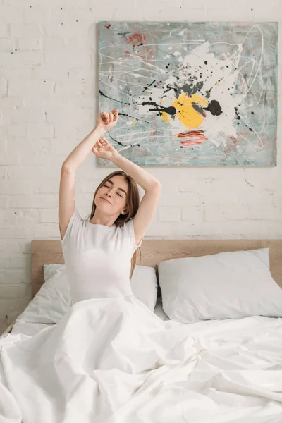 Happy Girl Sitting Bed Closed Eyes Stretching Raised Hands — Stock Photo, Image