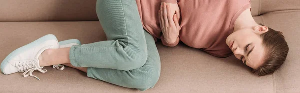 Panoramic Shot Unhappy Woman Lying Sofa While Suffering Stomach Pain — Stock Photo, Image