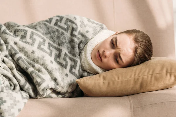 Sick Upset Girl Lying Sofa Blanket — Free Stock Photo