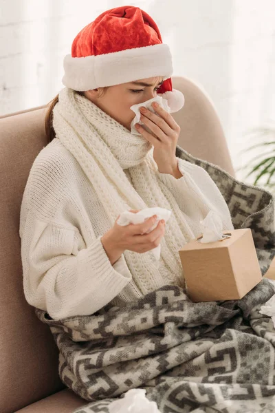 Sick Woman Sneezing Napking While Sitting Sofa Santa Hat — Stock Photo, Image