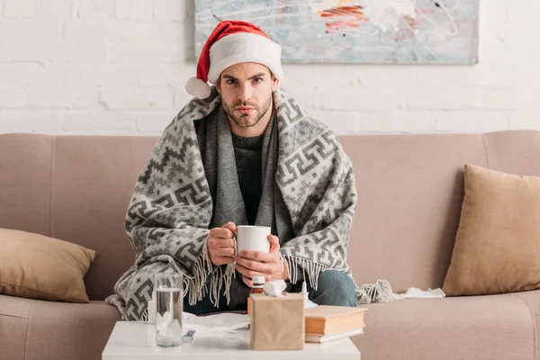 Sick Man Santa Hat Looking Camera While Holding Cup Warm — Stock Photo, Image