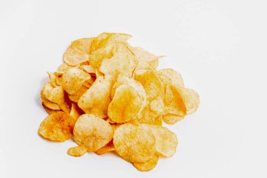 heap of fresh crunchy potato chips on white background clipart