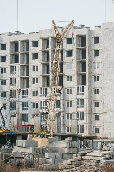 Construction site with crane and concrete blocks