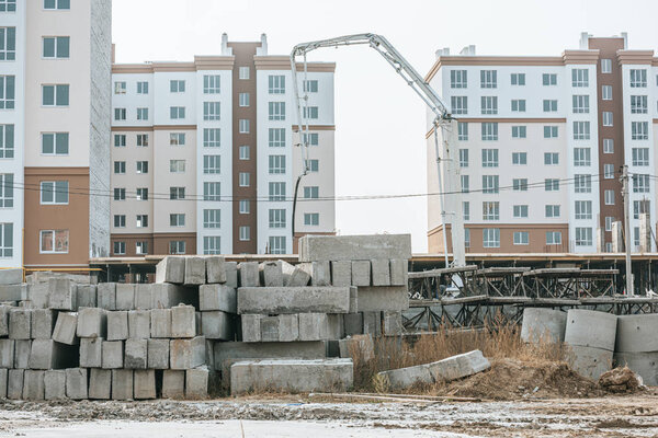 Construction site with concrete blocks and heavy machinery