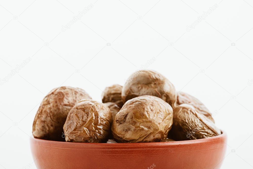 delicious jacket potato in clay bowl isolated on white