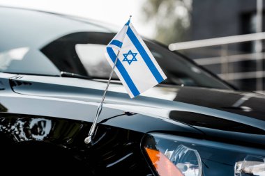 close up of israel flag on black modern car  clipart