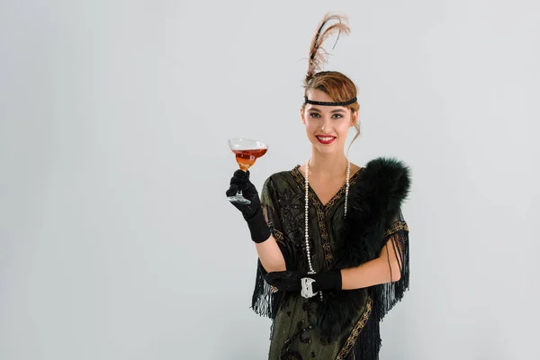 Vrolijke Aristocratische Vrouw Houden Glas Met Alcohol Drank Geïsoleerd Grijs — Stockfoto