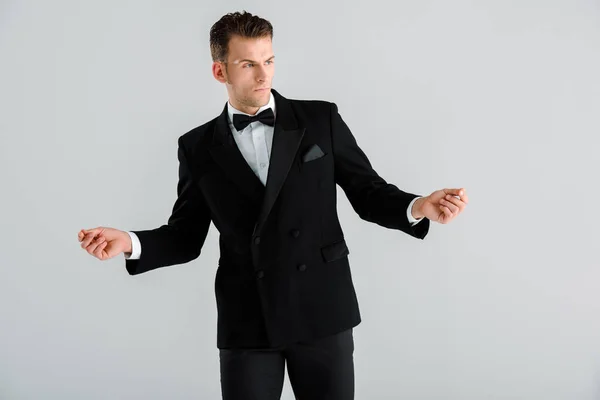 Handsome Man Black Suit Gesturing While Standing Isolated Grey — Stock Photo, Image
