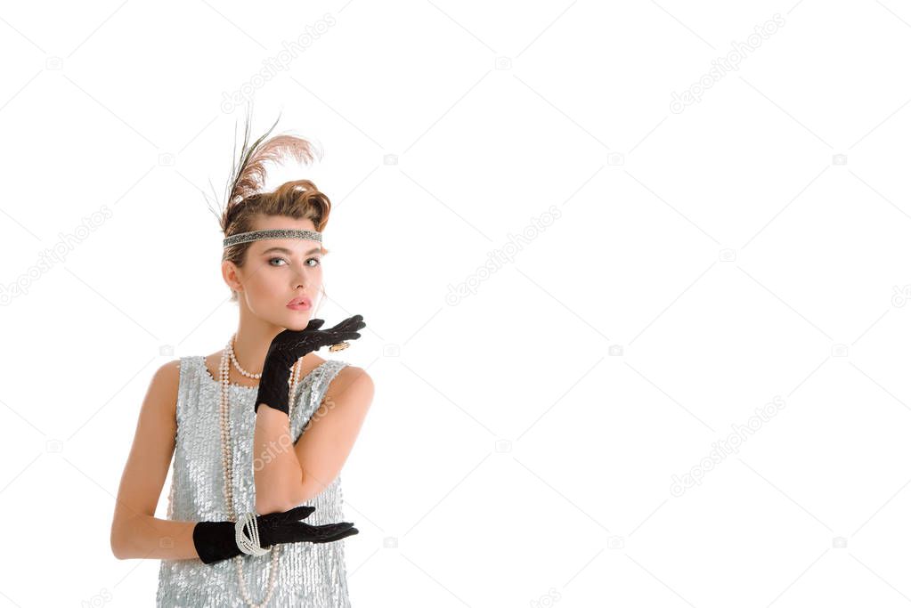 stylish woman in gloves looking at camera isolated on white 