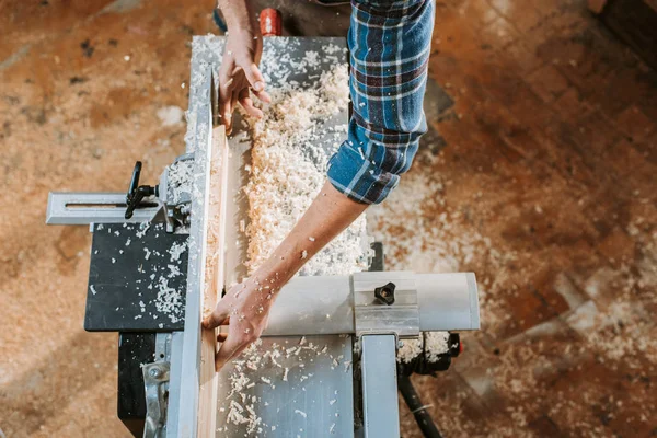 Top View Carpenter Holding Plank Circular Saw Workshop — Stock Photo, Image