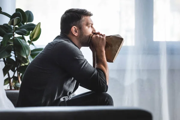 Side View Handsome Man Panic Attack Breathing Paper Bag Apartment — Stock Photo, Image