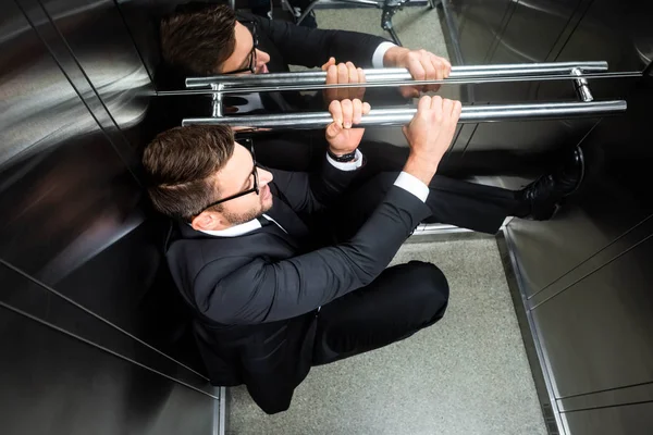 High Angle View Scared Businessman Suit Claustrophobia Sitting Floor Elevator — Stock Photo, Image