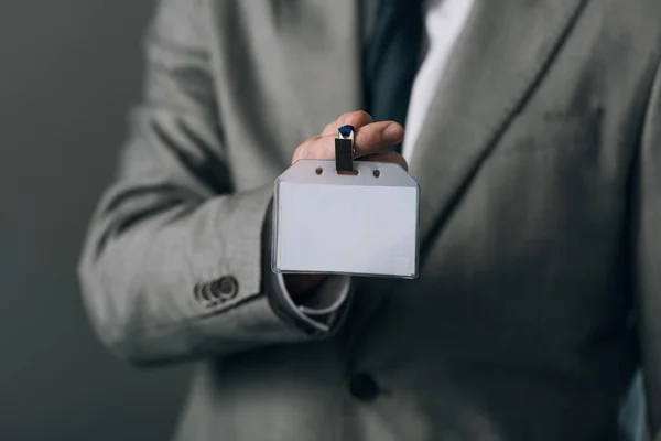 Cropped View Man Suit Holding Badge Copy Space Grey Background — Stock Photo, Image