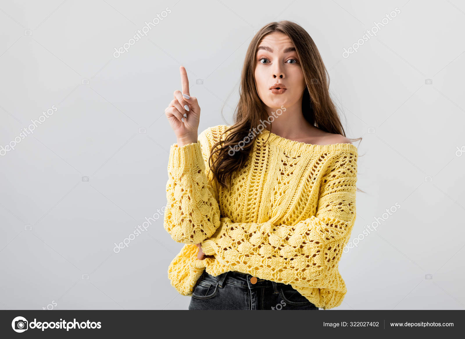 Amazed Girl Pointing Finger While Looking Camera Isolated Grey