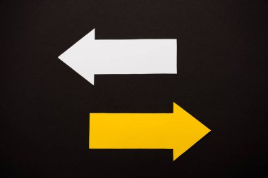top view of directional arrows showing left and right isolated on black  clipart