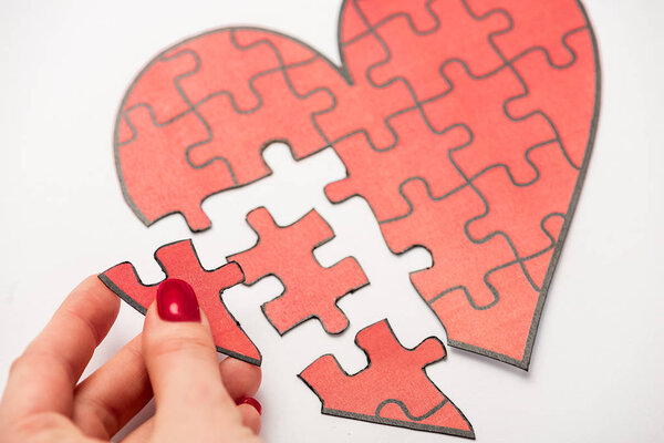 cropped view of woman red jigsaw isolated on white 