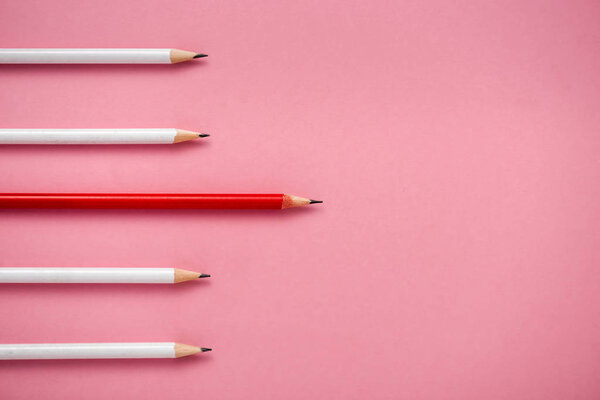top view of sharpened white and red pencils isolated on pink 
