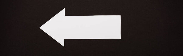 panoramic shot of directional arrow isolated on black 