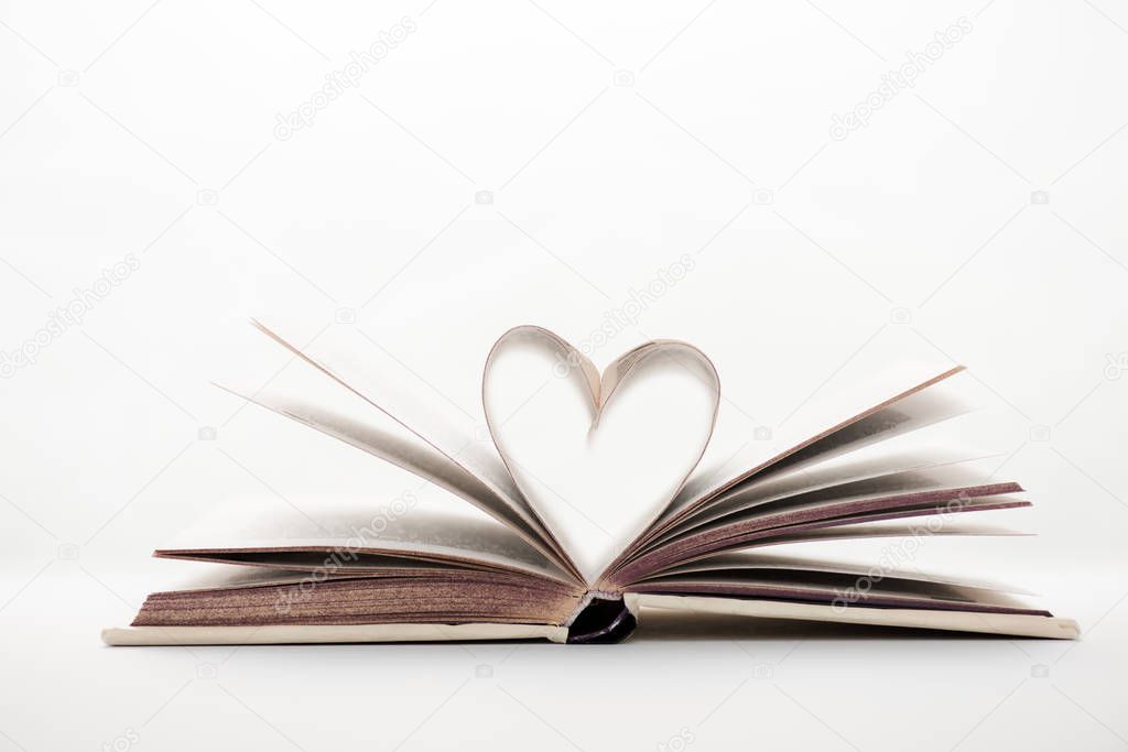 book with heart-shaped pages on white with copy space 