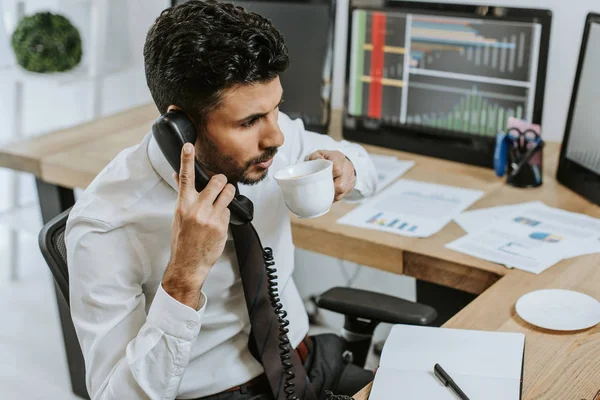 Racial Trader Drinking Coffee Talking Telephone Office — Stock Photo, Image