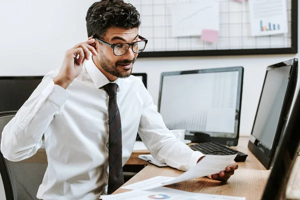 Pensive Racial Trader Sitting Table Looking Paper — Stock Photo, Image