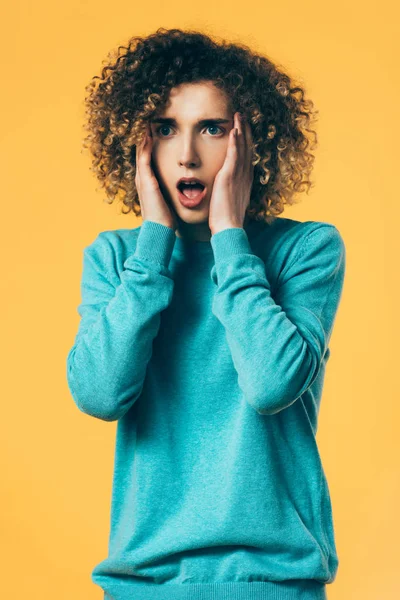 Scared Curly Teenager Touching Head Isolated Yellow — Stock Photo, Image