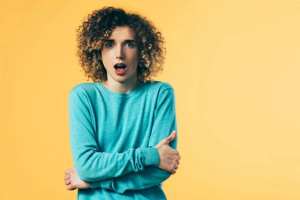 Shocked Curly Teenager Open Mouth Crossed Arms Isolated Yellow — Stock Photo, Image
