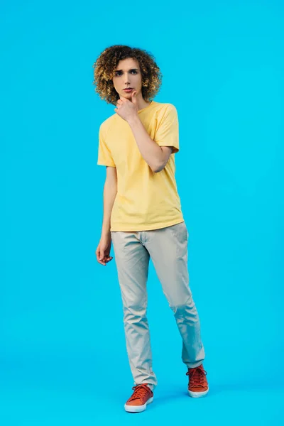 Pensive Curly Teenager Looking Away Isolated Blue — Stock Photo, Image