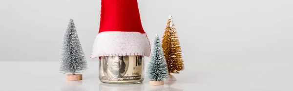 Panoramic Shot Decorative Small Pines Jar Dollar Banknotes Santa Hat — Stock Photo, Image