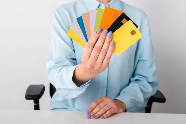 Vista Recortada Mujer Sosteniendo Plantillas Tarjetas Crédito Multicolores Aislados Blanco — Foto de Stock