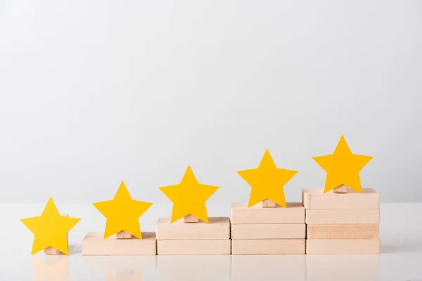 yellow stars on wooden cubes isolated on white 