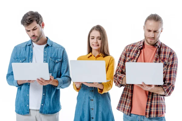 Confused Young Friends Holding Laptops Isolated White — Stock Photo, Image