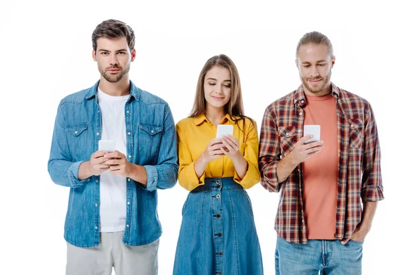 Smiling Three Young Friends Using Smartphones Isolated White — Stock Photo, Image