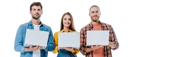 Smiling Three Young Friends Holding Laptops Isolated White Panoramic Shot — ストック写真