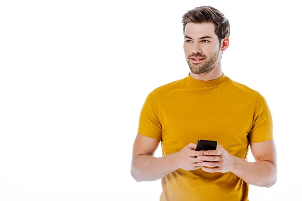 Knappe Man Met Smartphone Wegkijken Geïsoleerd Wit — Stockfoto