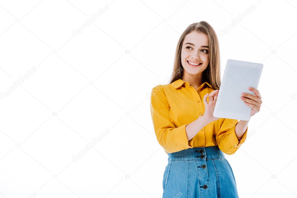 smiling attractive girl using digital tablet isolated on white