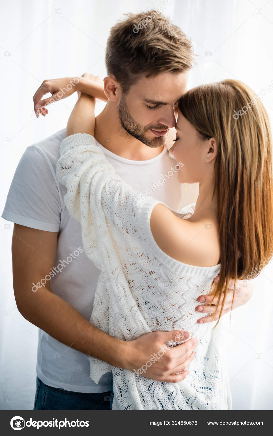 Handsome Smiling Man Hugging Woman Apartment Stock Photo by ...