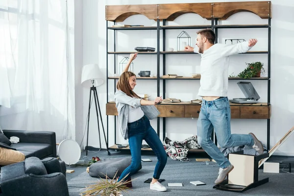 Smiling Woman Handsome Man Outstretched Hands Dancing Robbed Apartment — Stock Photo, Image