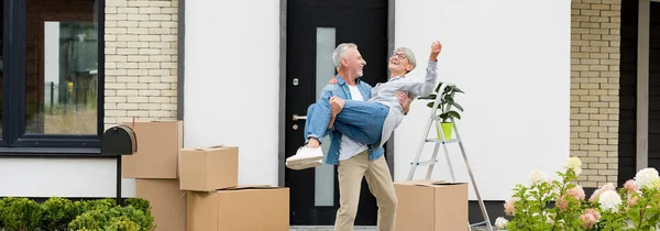 Panoramic Shot Mature Man Holding Smiling Woman New House — Stock Photo, Image