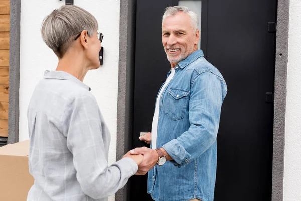 Mature Man Holding Hands Woman Standing New House — Stock Photo, Image