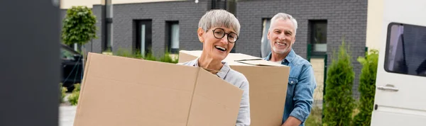 Panoramic Shot Mature Man Smiling Woman Bringing Boxes New House — Stock Photo, Image
